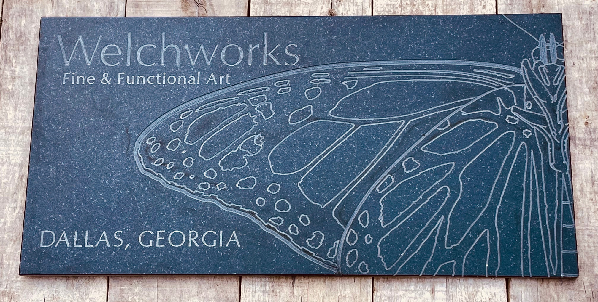 Welchworks sign engraved on black granite - 24" x 12".