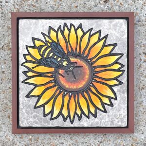 marble tile with image of sunflower and bee engraved and painted on it