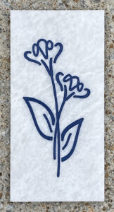 4in. x 8in. engraved white marble tile White marble tile with stylized flowers and leaves engraved and painted on it.