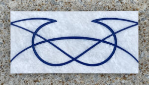 4in. x 8in. engraved white marble tile, blue lacquer White marble tile with a design engraved and painted in blue on it.